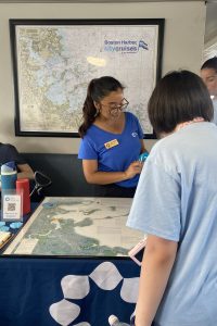 SLL Educator, Jasmine Perez, educating youth onboard the Spectacle Island Ferry about research and monitoring projects along the Boston Harbor Islands